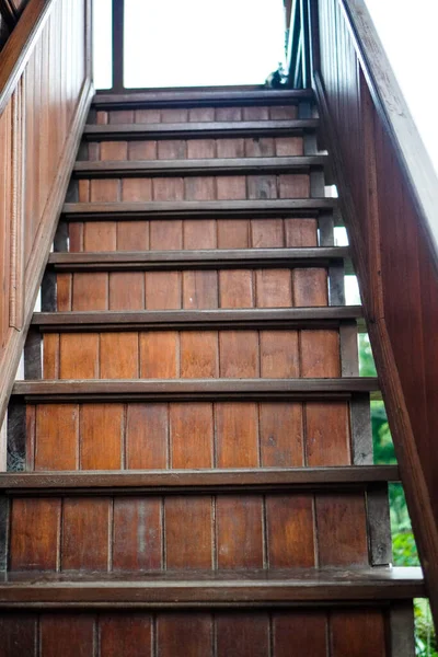 Close-up photo of natural wood stairs outdoors,the unique architecture of a building
