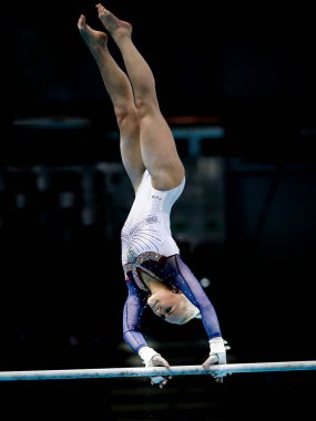 Szczecin, Poland, April 13, 2019: Angelina Melnikova of Russia competes in the uneven bars during the European artistic gymnastics championships 2019 clipart