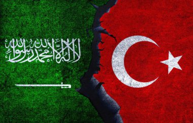Turkey vs Saudi Arabia concept flags on a wall with a crack. Saudi Arabia and Turkey political conflict, war crisis, economy relationship, trade concept