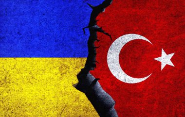 Turkey vs Ukraine concept flags on a wall with a crack. Ukraine and Turkey political conflict, war crisis, economy relationship, trade concept