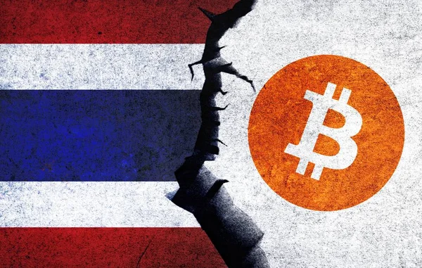 Bitcoin and Thailand flag on a wall with a crack. Thailand Bitcoin banned, not legal, stack, illegal, blockchain technology for crypto currency concept