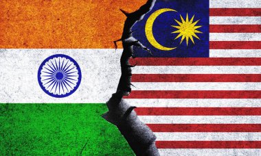 Malaysia vs India flags on a wall with a crack. India and Malaysia relation. India and Malaysia conflict, war crisis, relation, economy, trade concept