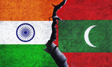 Maldives vs India flags on a wall with a crack. India and Maldives relation. India and Maldives conflict, war crisis, relation, economy, trade concept