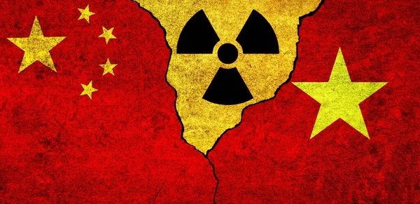 Flags of China, Vietnam and radiation symbol together. Vietnam and China Nuclear deal, threat, agreement, tensions concept