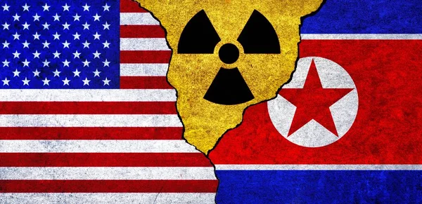 Flags of USA, North Korea and radiation symbol together. United States of America and North Korea Nuclear deal, threat, agreement, tensions concept