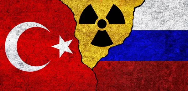 Flags of Turkey, Russia and radiation symbol together. Russia and Turkiye Nuclear deal, threat, agreement, tensions concept
