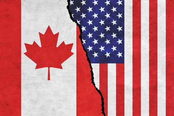 USA and Canada painted flags on a wall with a crack. United States of America and Canada relations. Canada and USA flags together
