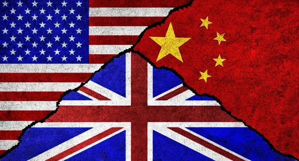 USA, United Kingdom and China flag together on a textured wall. Relations between China, Great Britain and United States of America