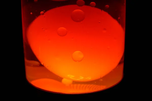 Macro photo of a lava lamp in the darkness. Background picture. . High quality photo