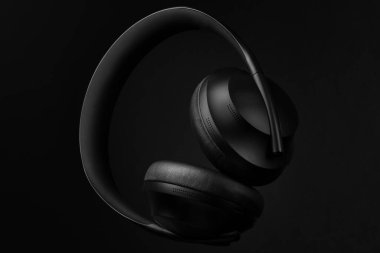 Black set of modern high-end sound headphones, headset for studio or outdoors.