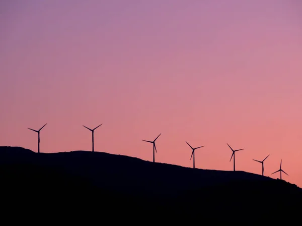 Wind turbines during sunset, Galaxidi, Greece. High quality photo