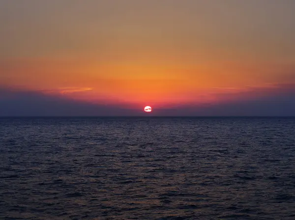 Beautiful sunset in aegean sea over ferry, Greece 