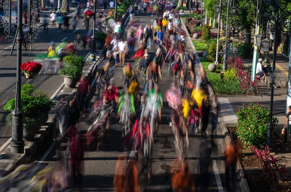 The movement of people who cycling, running and walking in slow speed photography. This people enjoy the car free day.