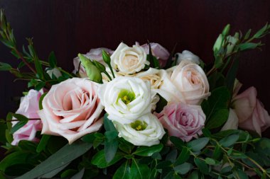 Elegant Wedding Bouquet in Beautiful Pink, White, and Apricot Roses Isolated on Black Background