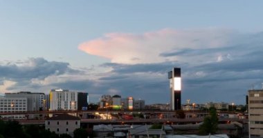 Day to night timelapse of the city of Mestre Venice Italy showing epic storm clouds, city traffic and blinking billboard screen of the Mestre Hybrid Tower. High quality 4K footage.