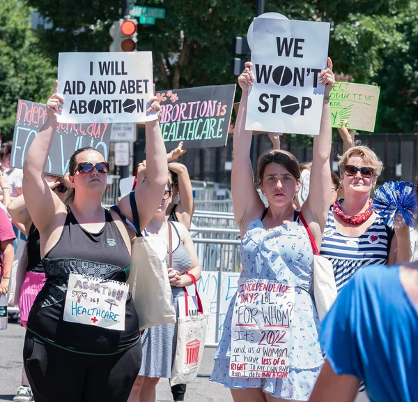  2 people standing together 