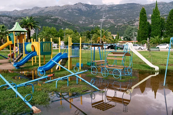 Playground in the park flooded after rain. High quality photo