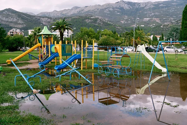 Huge Puddle Front Playground Green Meadow Front Houses High Quality — Φωτογραφία Αρχείου