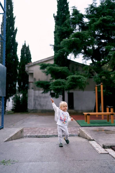 Little Girl Tracksuit Walks Playground High Quality Photo — Foto Stock