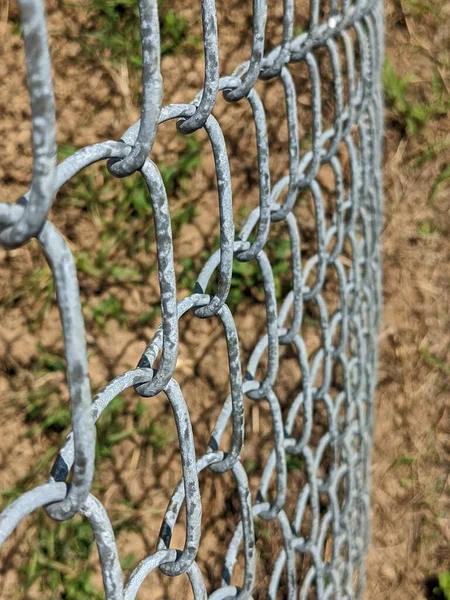 close up looking down on a chain link fence