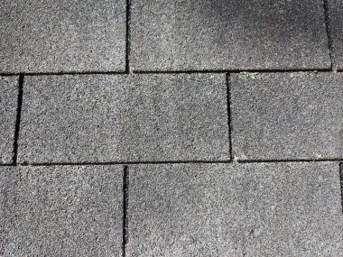 close up roofing shingles that are grey