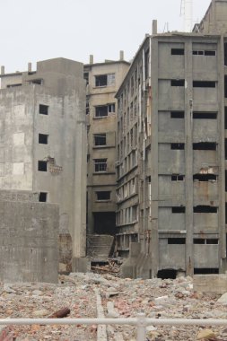 Abandoned old buildings in the battleship of Hashima Island. Ancient buildings and ruins of coal mining Island. It is also a UNESCO world heritage site. 