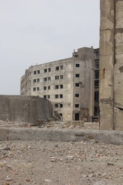 Abounded buildings in Battleship Island of Japan. Ruins of Hashima Island coal mine.