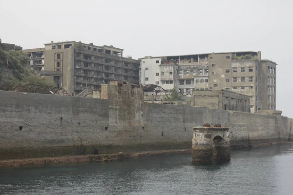 Unique view of Battlefield Island of Japan. Hashima Island view from the sea. Historical place in Nagasaki.