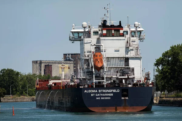 Port Colborne, Ontario, Canada  JULY 10, 2022: The bulk carrier Algoma Strongfield is heading downbound on the Welland Canal, just after clearing Bridge 21.  