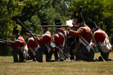 FORT ERIE, ONTARIO, CANADA: August 6, 2022, British soldiers fire on the approaching American forces during the Siege of Fort Erie War of 1812 Reenactment weekend.