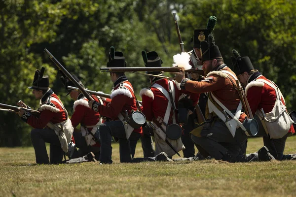 FORT ERIE, ONTARIO, CANADA: August 6, 2022, British soldiers fire on the approaching American forces during the Siege of Fort Erie War of 1812 Reenactment weekend.