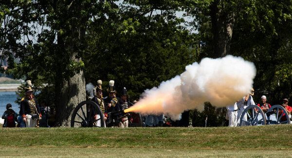 FORT ERIE, ONTARIO, CANADA - August 6, 2022 -  American artillery opens fire on the British at the Siege of Fort Erie War of 1812 reenactment weekend.