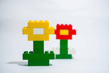Colorful plastic block toy in the shape of a flower character.