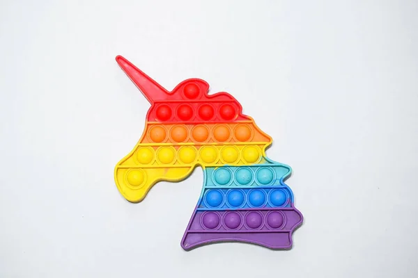 Pop it toy in the shape of a unicorn character