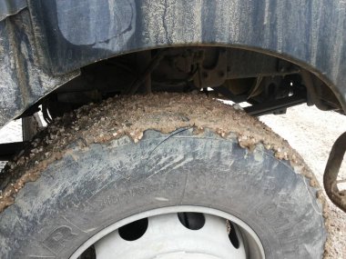 a car tire that looks dirty is black