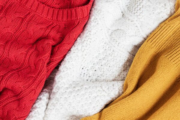Close-up of multicolored warm knitted things. Top view