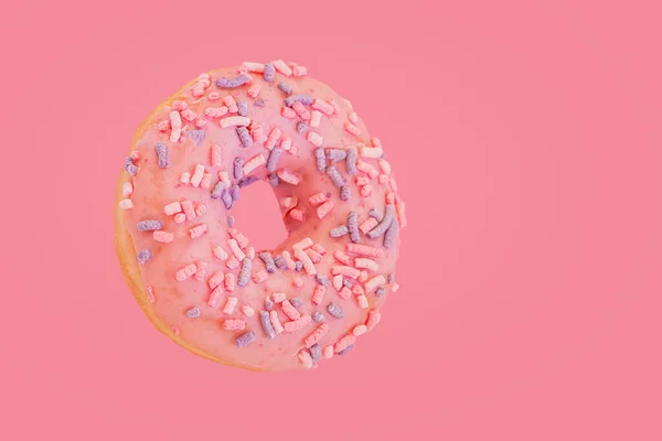 Rosado donut con coloridos espolvoreos sobre fondo rosa. Concepto de comida dulce y postres — Foto de Stock