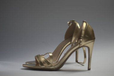 high-heeled gold sandals