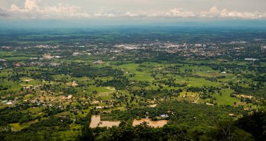 The beautiful natural landscape of a small urban community and fog in the rainy season of Thailand.