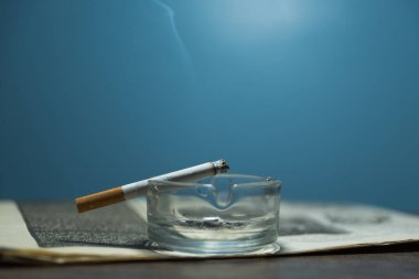 smoking marijuana and tobacco. cigarette on a wooden table.