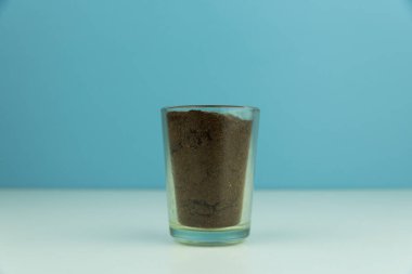 green tea glass on a blue background