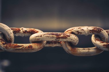 Close up of old chain whit brown rust. Abstract backgrounds with a vintage style.