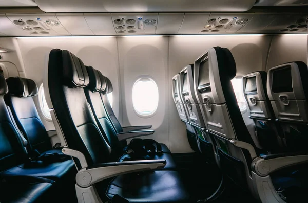A Empty airplane seats seen from inside with window and copyspace