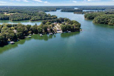 Aerial view of lake homes and boat houses at Dripping Springs on