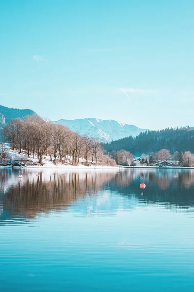 Picturesque fishing village on the coast of the lake Tegernsee. Alpine mountains in Bavaria. Beautiful landscape in Germany. Adventure in Europe.
