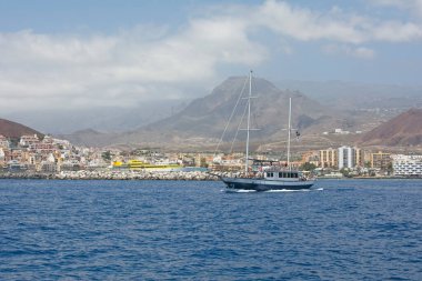 Coastline with town, ship and mountains from south coast of Canary Island Tenerife, Los Cristianos, Spain, Europe