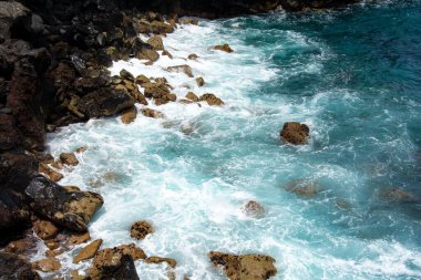 Rocks in the breakers on the coast of the Canary Island of Tenerife, Spain
