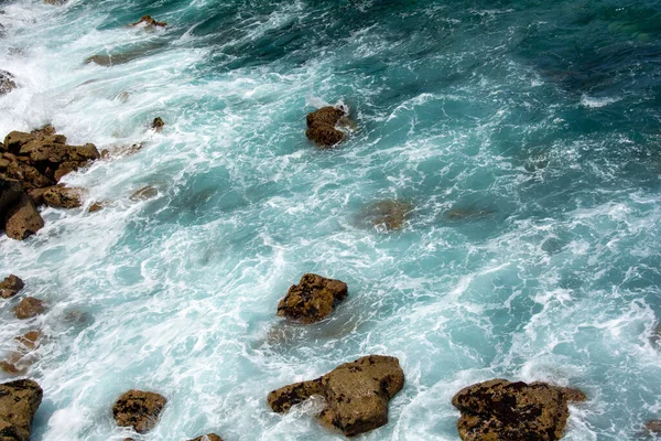 Rocks in the breakers on the coast of the Canary Island of Tenerife, Spain