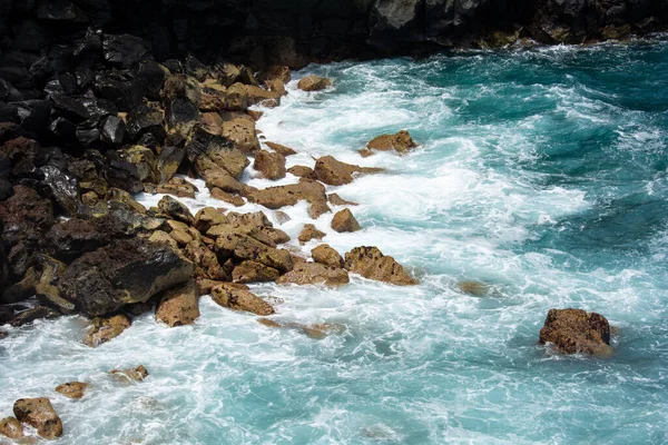 Rocks in the breakers on the coast of the Canary Island of Tenerife, Spain
