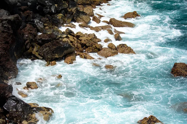 Rocks in the breakers on the coast of the Canary Island of Tenerife, Spain